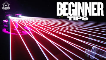 Laser light show projector beams in haze (club setup)