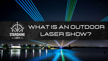 outdoor laser show over a city festival crowd