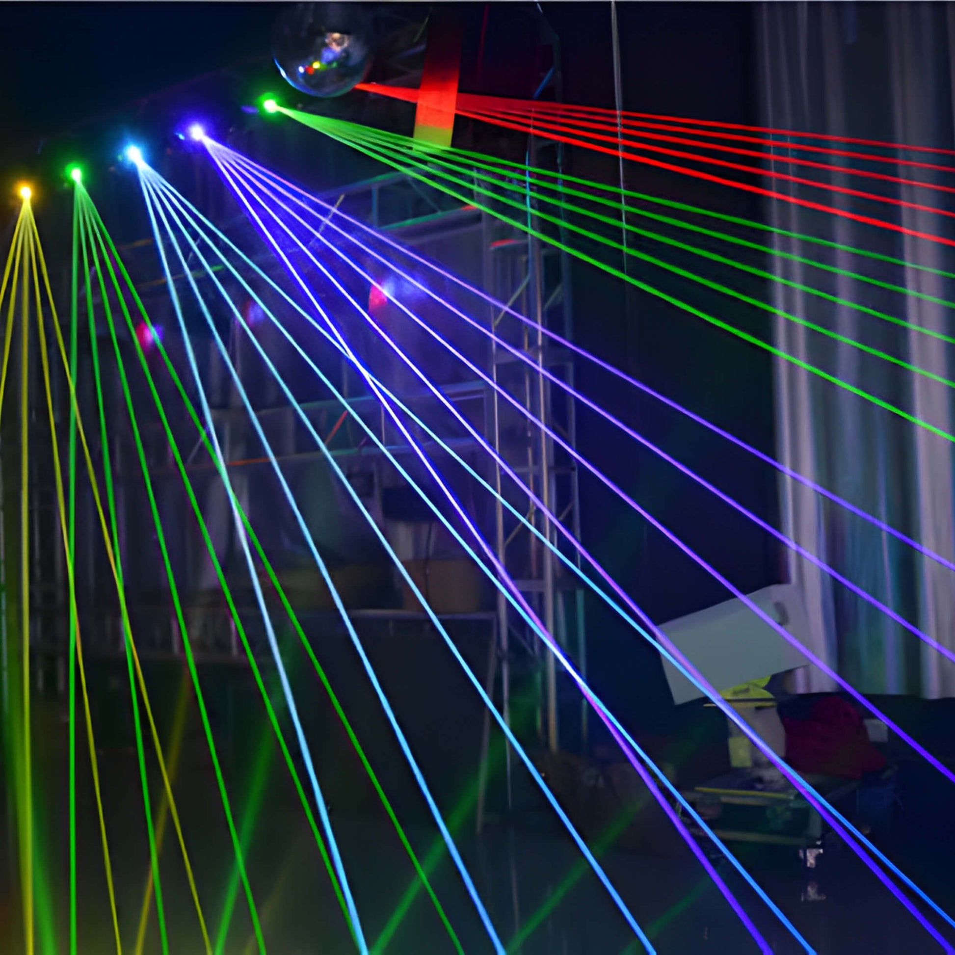 Laser beams sweeping across crowd in dance hall from M20 fixtures