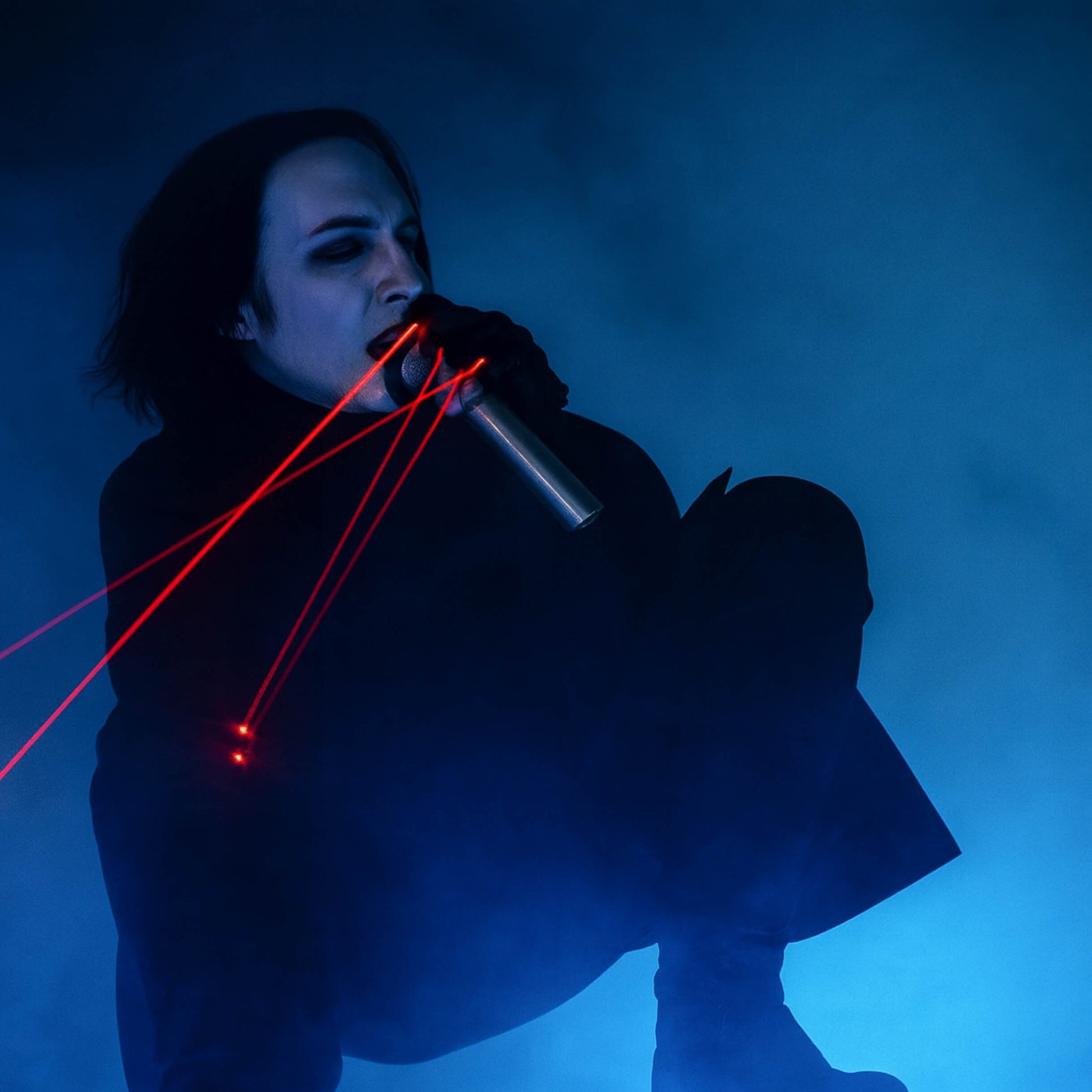 Stage laser gloves fan burst cue during a club drop